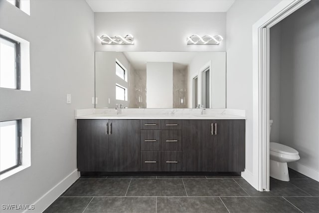 bathroom featuring vanity, toilet, and tile patterned floors