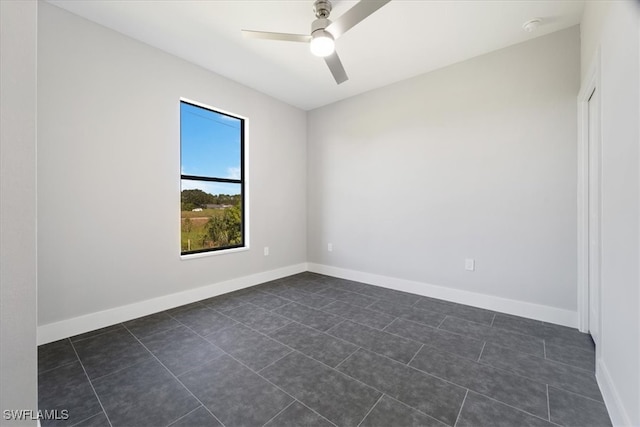 tiled empty room with ceiling fan