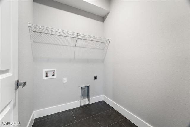 laundry area with dark tile patterned flooring, washer hookup, and electric dryer hookup