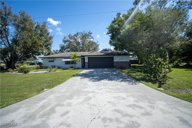 single story home with a front lawn and a garage