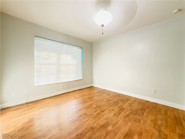 empty room with light hardwood / wood-style flooring