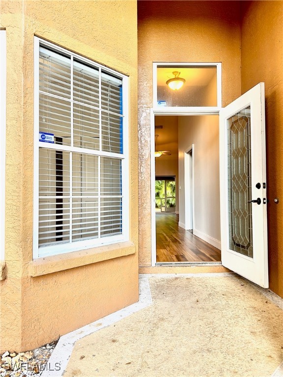 property entrance with a patio area