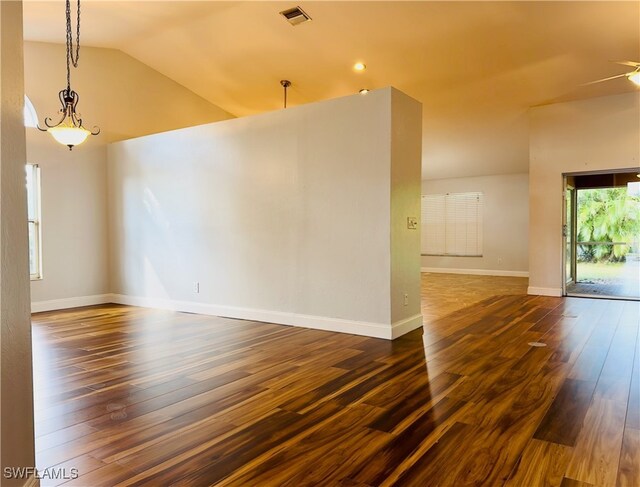 unfurnished room with ceiling fan, lofted ceiling, and dark hardwood / wood-style floors