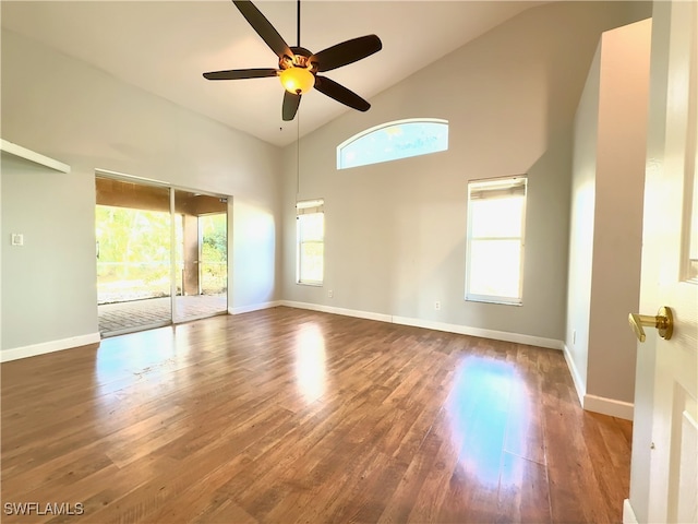 spare room with ceiling fan, high vaulted ceiling, and dark hardwood / wood-style flooring