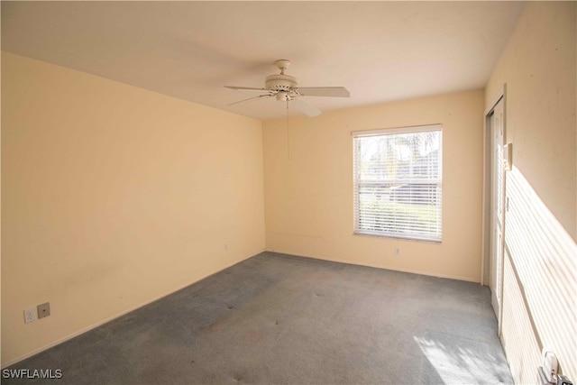 carpeted empty room with ceiling fan