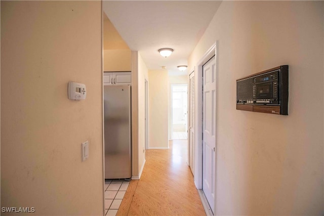 corridor featuring light hardwood / wood-style floors