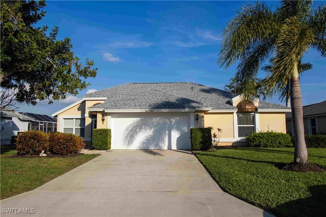 single story home with a front lawn and a garage