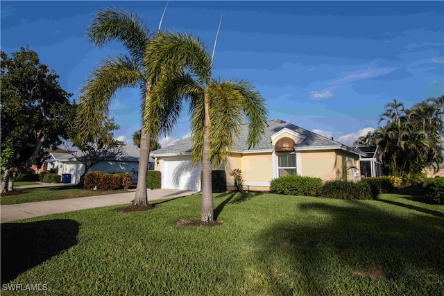 ranch-style home with a front yard and a garage