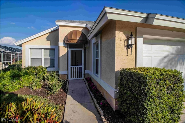 doorway to property featuring a garage