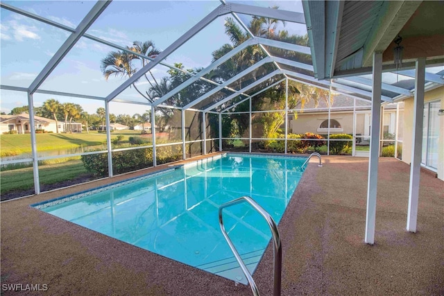 view of pool featuring a patio and glass enclosure