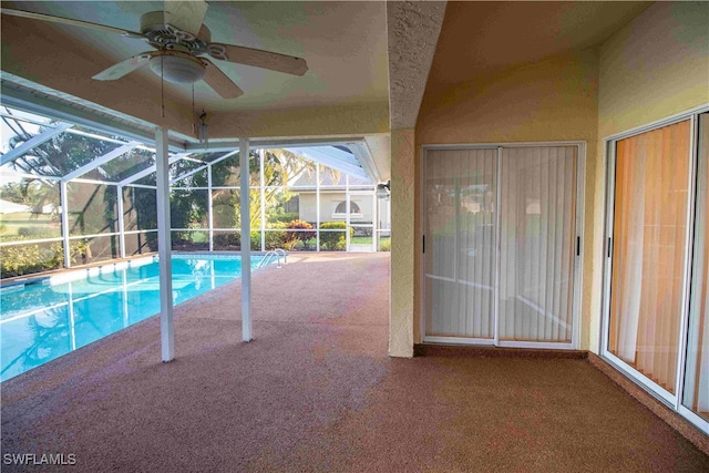 view of pool with a patio area, a lanai, and ceiling fan