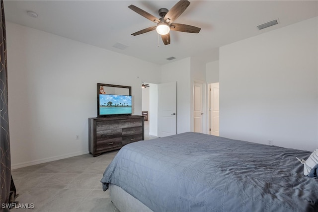 bedroom with ceiling fan and light tile patterned floors