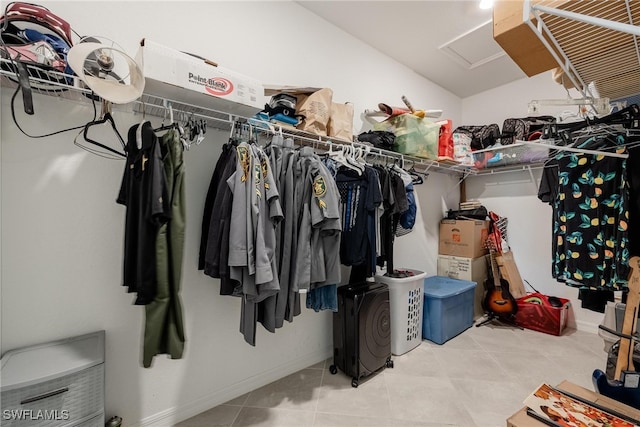 spacious closet featuring light tile patterned floors