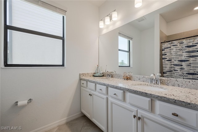 bathroom with vanity and a shower with shower curtain