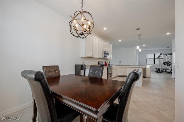 tiled dining area with an inviting chandelier