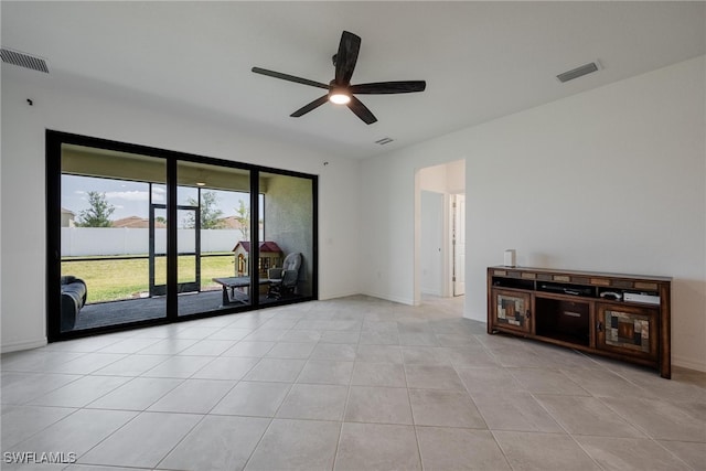 unfurnished living room with light tile patterned flooring and ceiling fan