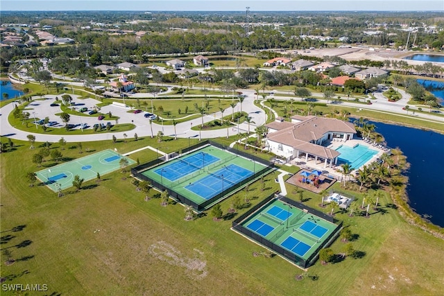 birds eye view of property with a water view