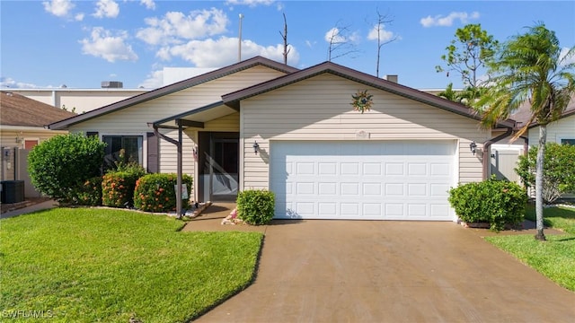 view of front of home with a garage and a front lawn