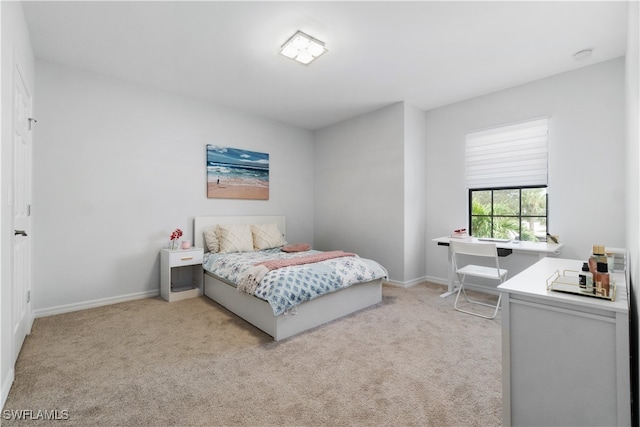 bedroom with light colored carpet