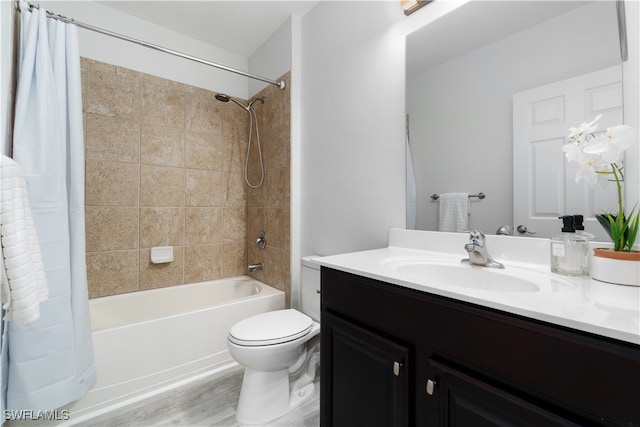 full bathroom with toilet, hardwood / wood-style flooring, vanity, and shower / bathtub combination with curtain