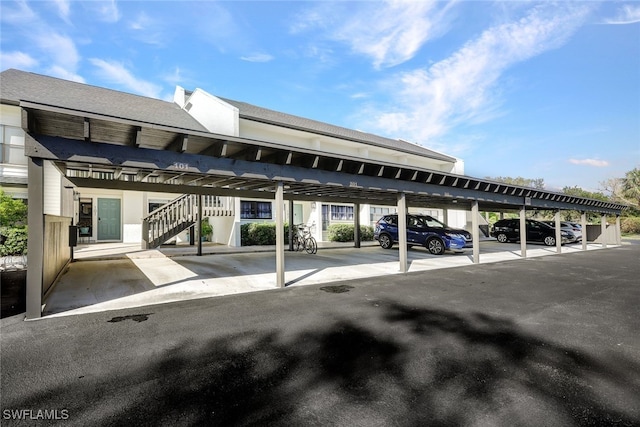 view of parking / parking lot with a carport