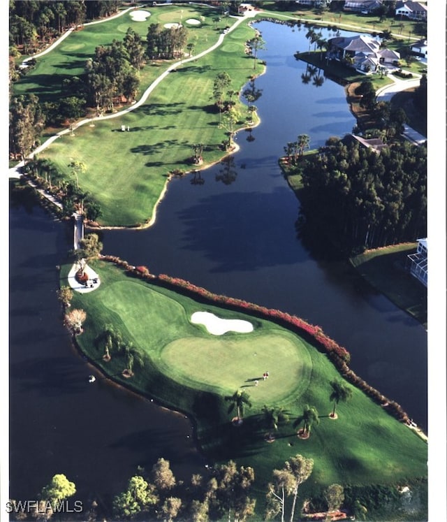 aerial view featuring view of golf course and a water view