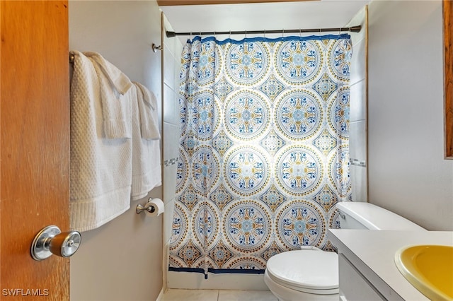 bathroom with a shower with curtain, tile patterned flooring, vanity, and toilet