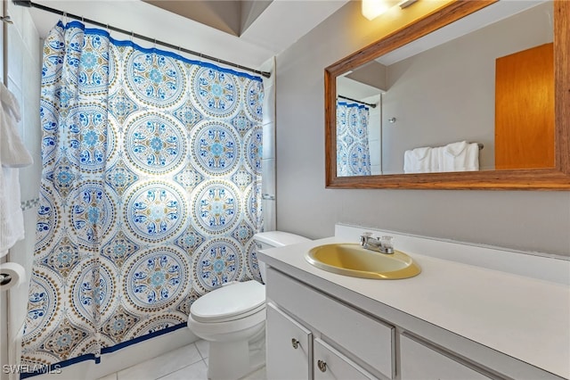 bathroom with tile patterned floors, vanity, and toilet