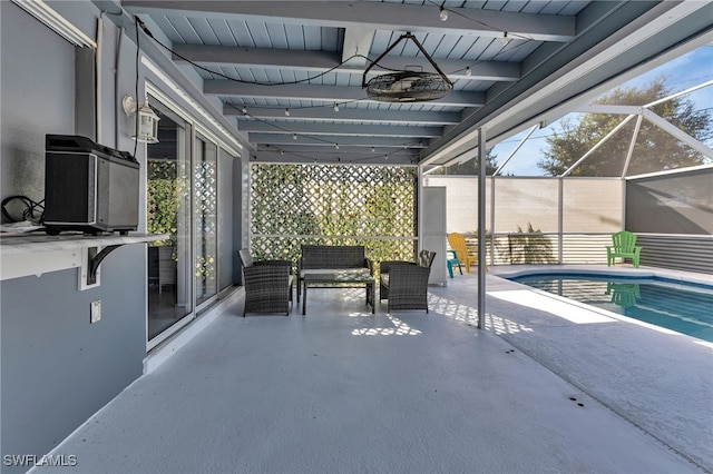 view of patio with glass enclosure and ceiling fan