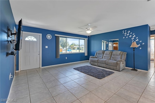 living room featuring light tile patterned floors and ceiling fan