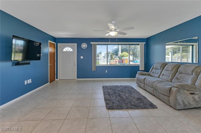 living room featuring ceiling fan and light tile patterned flooring