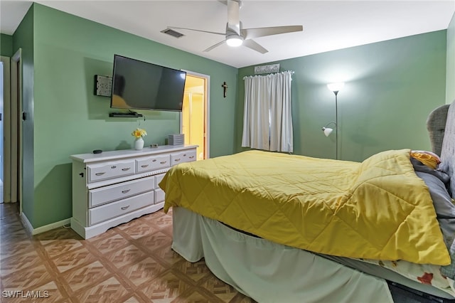 bedroom featuring ceiling fan and light parquet flooring