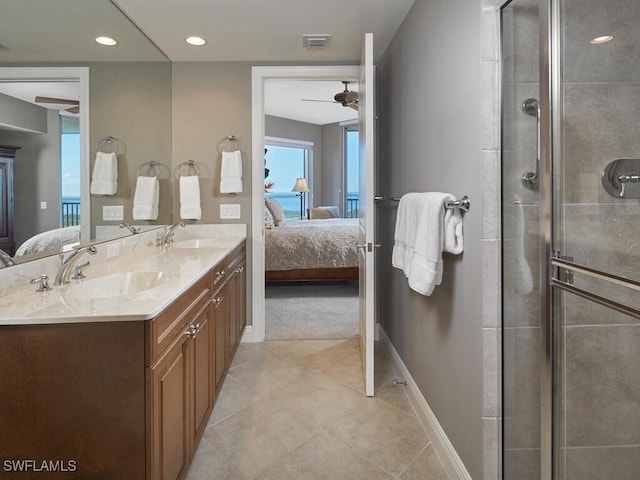 bathroom with vanity, walk in shower, tile patterned floors, and ceiling fan