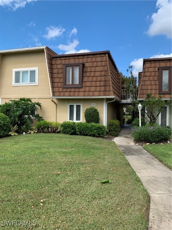 view of property exterior with a lawn