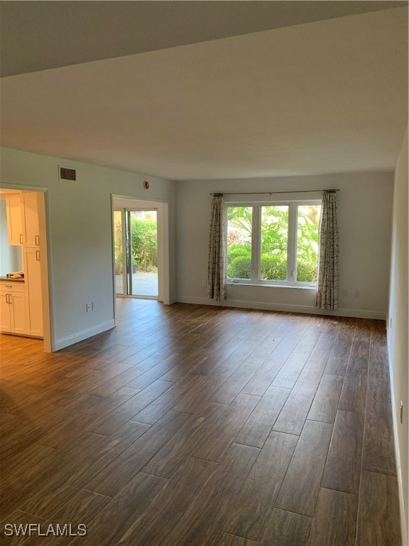 empty room featuring dark hardwood / wood-style floors