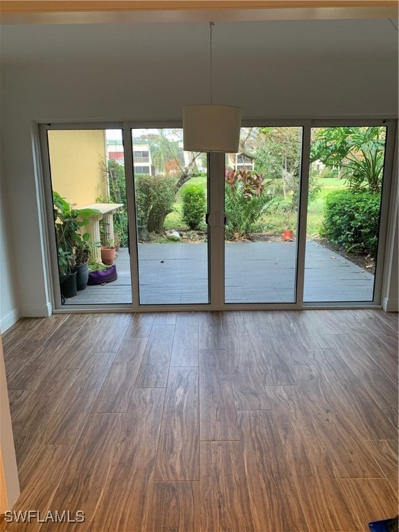 doorway to outside with hardwood / wood-style floors