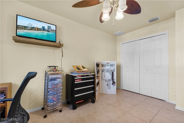 office space with ceiling fan and light tile patterned floors