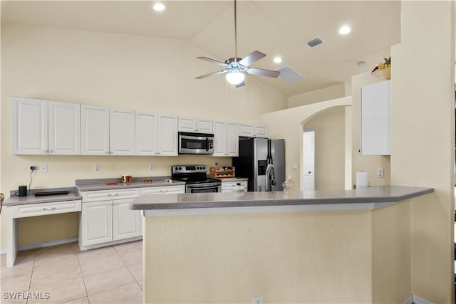 kitchen with appliances with stainless steel finishes, kitchen peninsula, high vaulted ceiling, and white cabinets