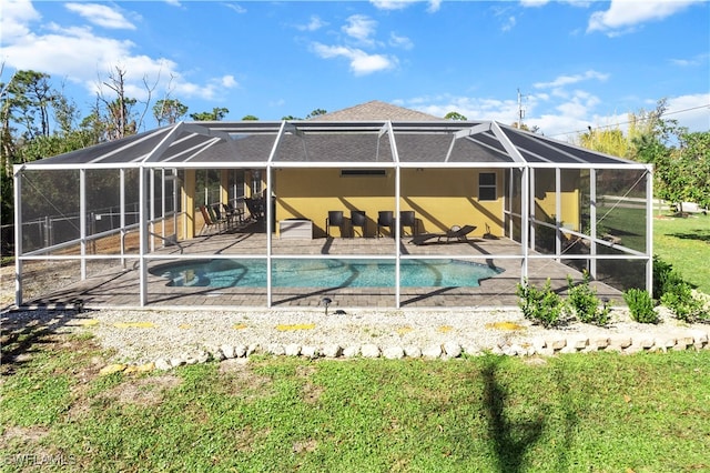 rear view of property with a patio area and a lanai