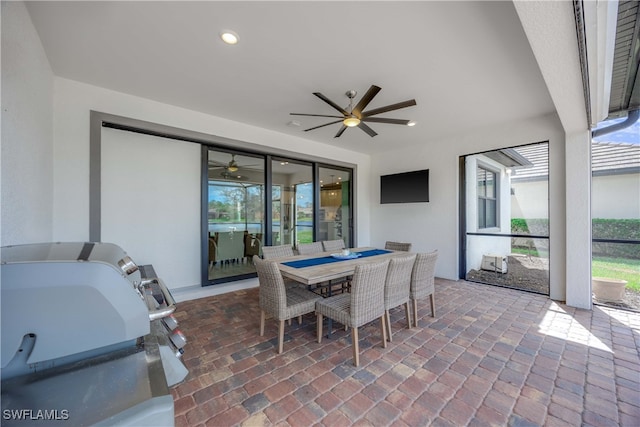 view of patio / terrace featuring a lanai and ceiling fan