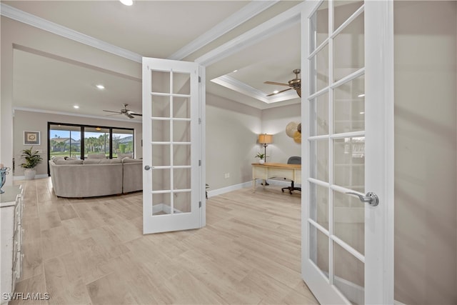 interior space featuring french doors, crown molding, light hardwood / wood-style floors, and ceiling fan