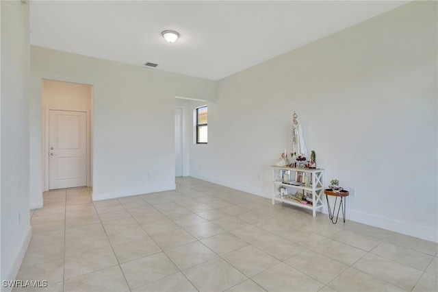 empty room with light tile patterned floors