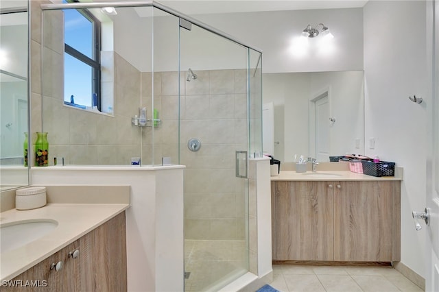 bathroom featuring vanity, tile patterned flooring, and an enclosed shower