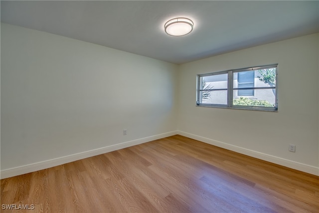 spare room featuring light wood-type flooring