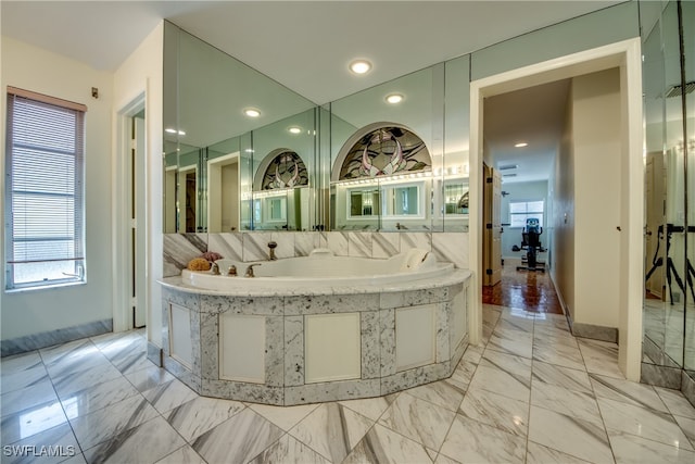 bathroom featuring a tub to relax in