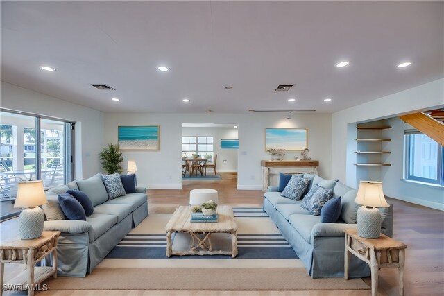 living room with light hardwood / wood-style flooring