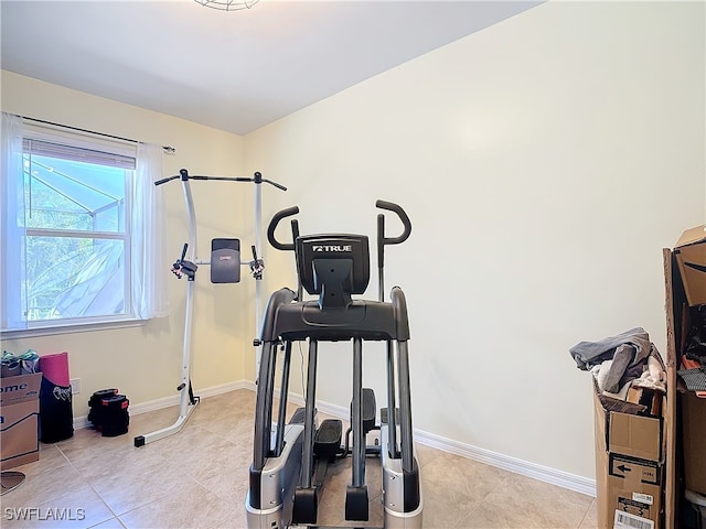 workout room with light tile patterned flooring