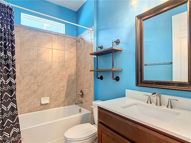 full bathroom with vanity, shower / tub combo, and toilet