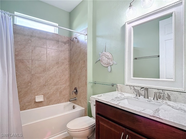 full bathroom featuring vanity, shower / bath combo, and toilet