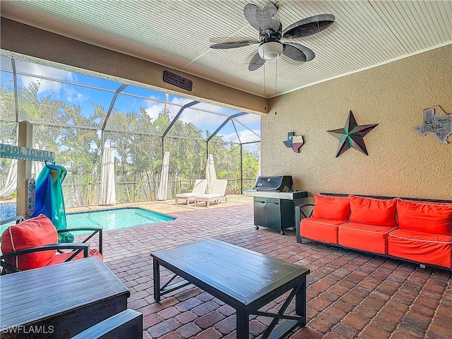 view of patio featuring ceiling fan and a lanai